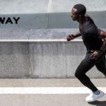 Young male running.